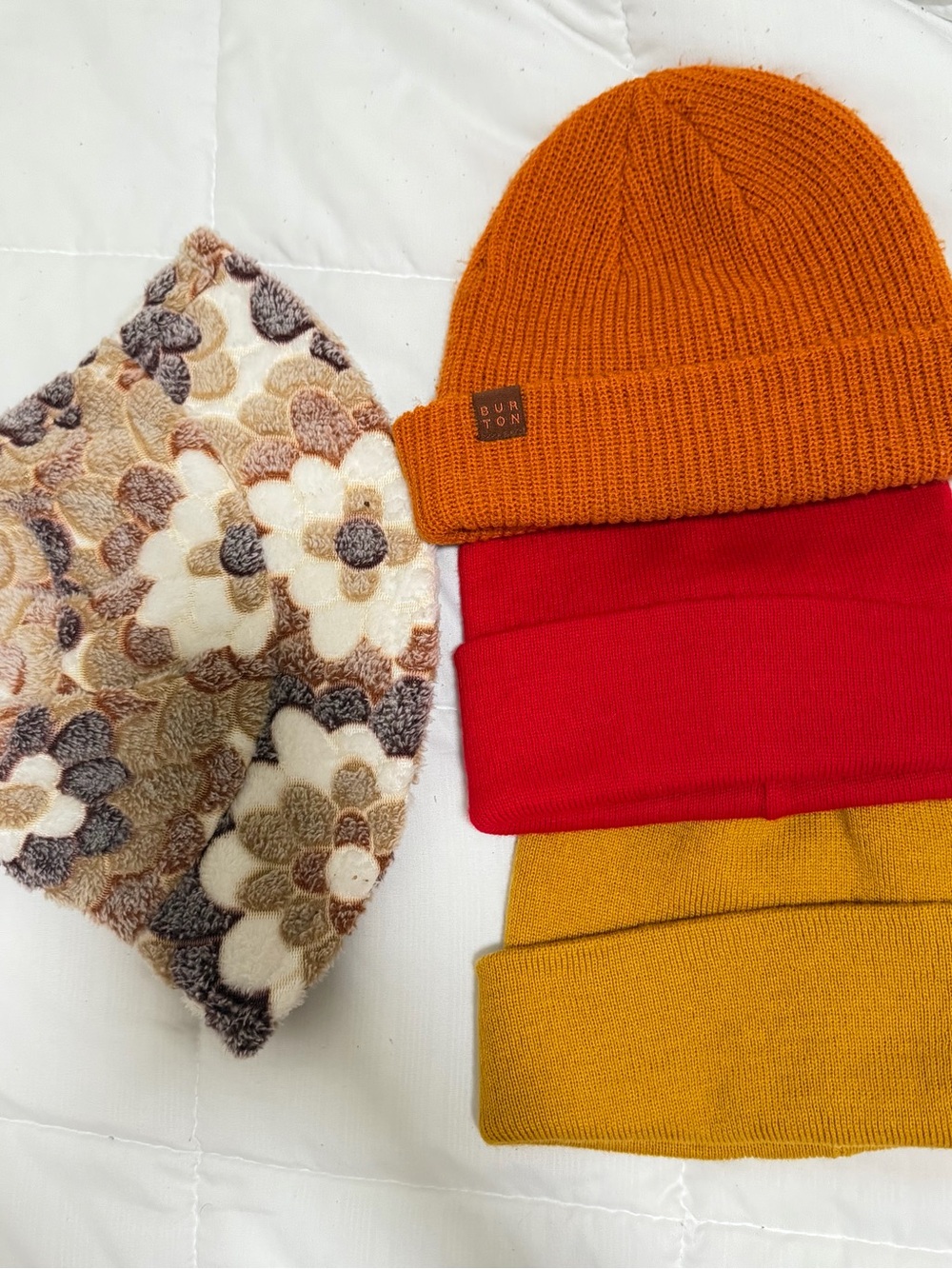 All for $20
Burton Orange Ribbed Beanie with Red and Mustard Knit Hats